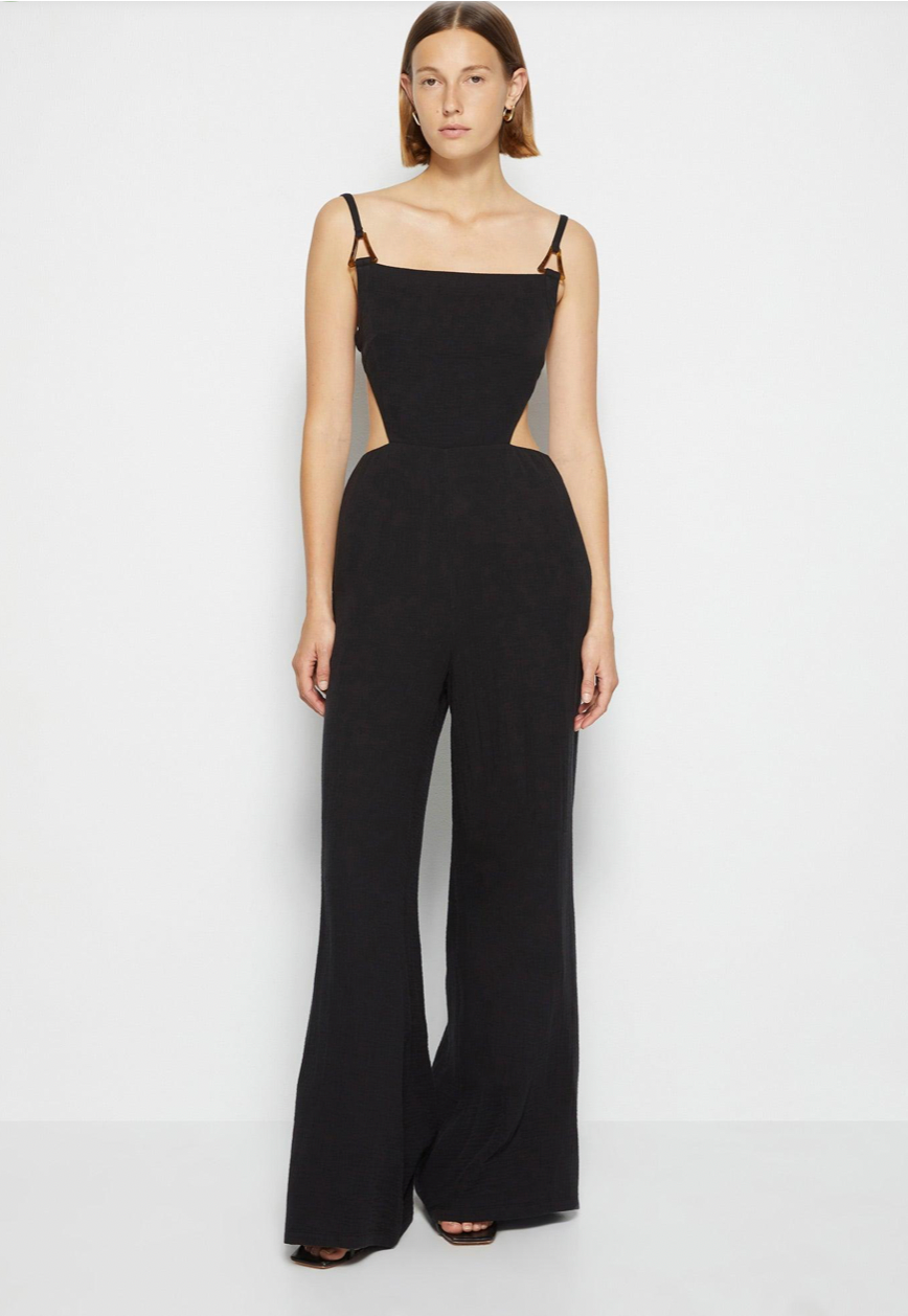 The Combinaison Mabel is an elegant and versatile jumpsuit from the SIMKHAI collection. Made with high-quality cotton, it features a unique Mabel cutout design that adds a touch of sophistication. Perfect for any occasion, this jumpsuit will make you look and feel stylish and confident.