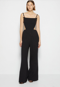 The Combinaison Mabel is an elegant and versatile jumpsuit from the SIMKHAI collection. Made with high-quality cotton, it features a unique Mabel cutout design that adds a touch of sophistication. Perfect for any occasion, this jumpsuit will make you look and feel stylish and confident.