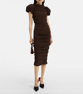 Elevate your wardrobe with this expert-crafted puff-sleeve silk midi dress by Magda Butrym. Designed with voluminous sleeves and a fluid silhouette, it combines luxurious silk fabric with sophisticated tailoring to create a timeless piece. Perfect for formal events or refined everyday elegance, the dress offers both comfort and statement style, reflecting meticulous attention to detail and high-quality craftsmanship.