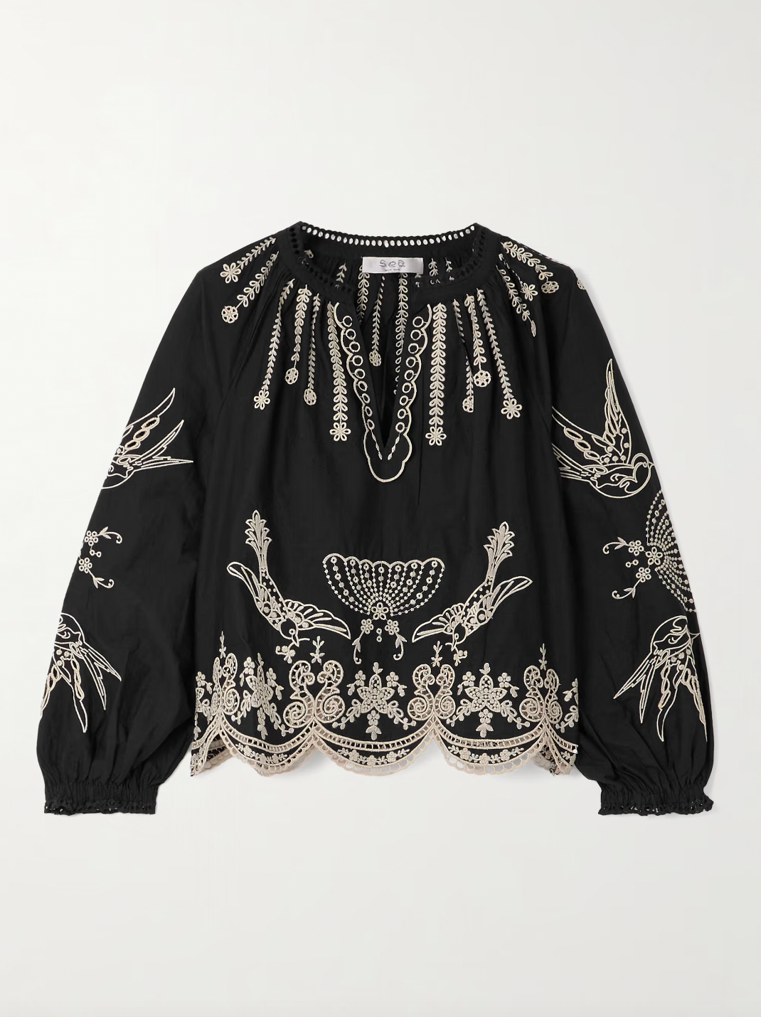 This Kingsley embroidered cotton-poplin blouse by SEA combines delicate craftsmanship with effortless style. Crafted from soft cotton-poplin, it features charming floral and bird embroidery alongside elegant swirling patterns. The loose fit enhances comfort, while scalloped edges and crocheted trims along the notched neckline add a touch of refined detail. Perfect for elevating any outfit with graceful ease.