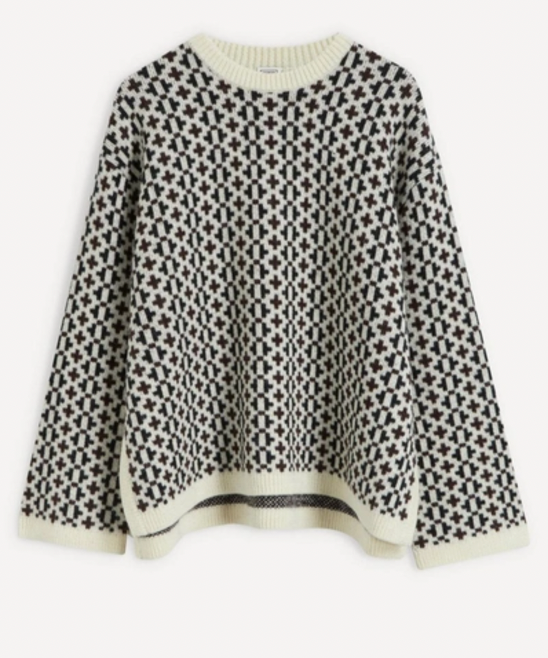 Indulge in the luxurious warmth and style of the Knit Cross-Pattern Wool Pullover by TOTEME. Crafted from high-quality virgin wool, this Norwegian-inspired piece boasts a structured fit and wide silhouette for a sophisticated look. The jacquard woven fabric features a unique cross pattern, while the ribbed neck, cuffs, and hem add texture and comfort. With dropped shoulders and side slits, this pullover is both elegant and versatile. 