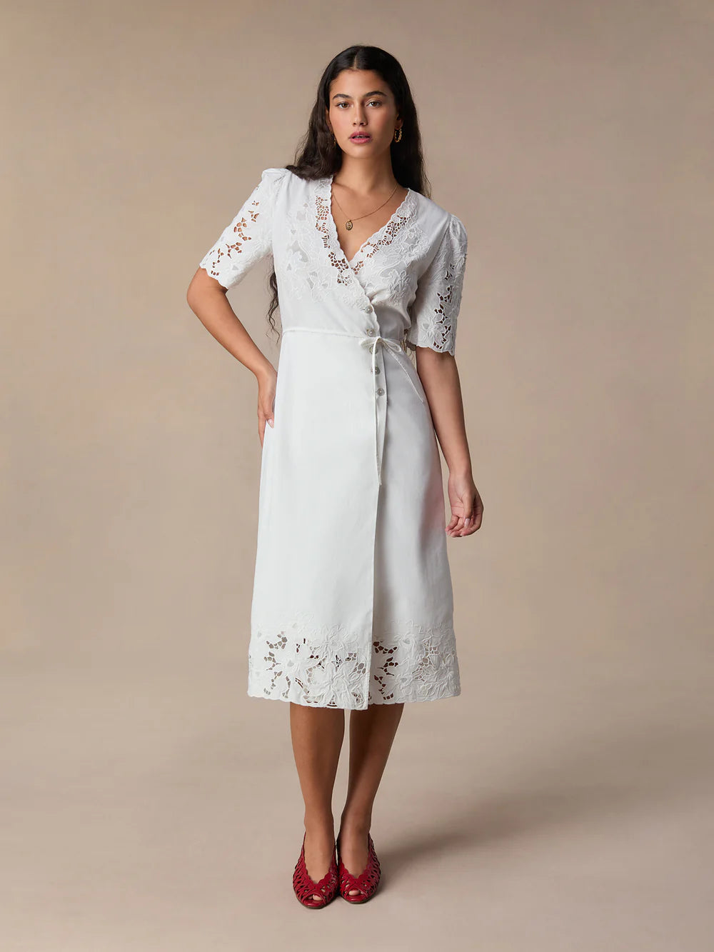 Transform your wardrobe with our Sara Midi Dress! This stunning white embroidered wrap dress exudes elegance and charm. Perfect for any occasion, its mid-length style offers a timeless silhouette that will flatter any body type. Make a statement with this must-have dress that will leave you feeling confident and beautiful.