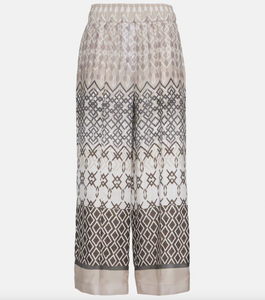 Introducing Brunello Cucinelli's wide-leg pants, made from luxurious pure silk-voile for maximum comfort. Featuring an elasticated waist and a stylish geometric print in versatile neutral tones, these pants are perfect for your vacation wardrobe. Enjoy a comfortable and chic look all vacation long.