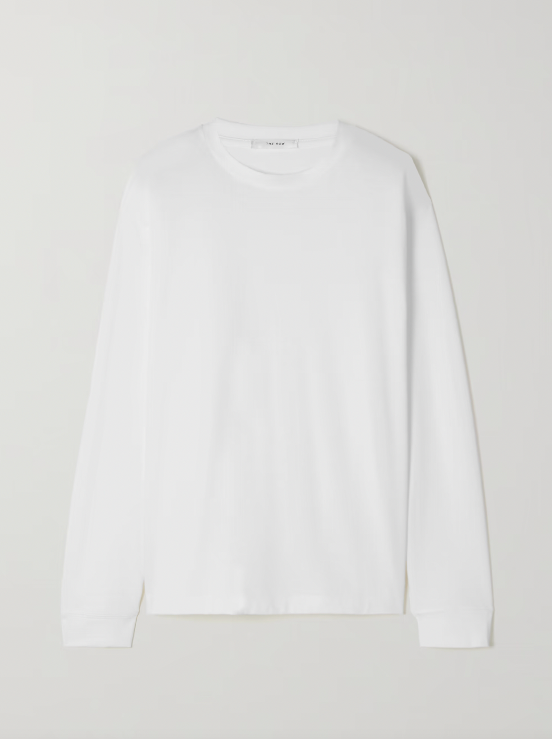Crafted from premium cotton-jersey, the Ciles T-shirt embodies The Row's philosophy of timeless design and exceptional quality. Its relaxed silhouette offers effortless versatility—pair it with tailored trousers for polished sophistication, tuck it into denim for casual elegance, or layer it under midi skirts for refined dimension. 