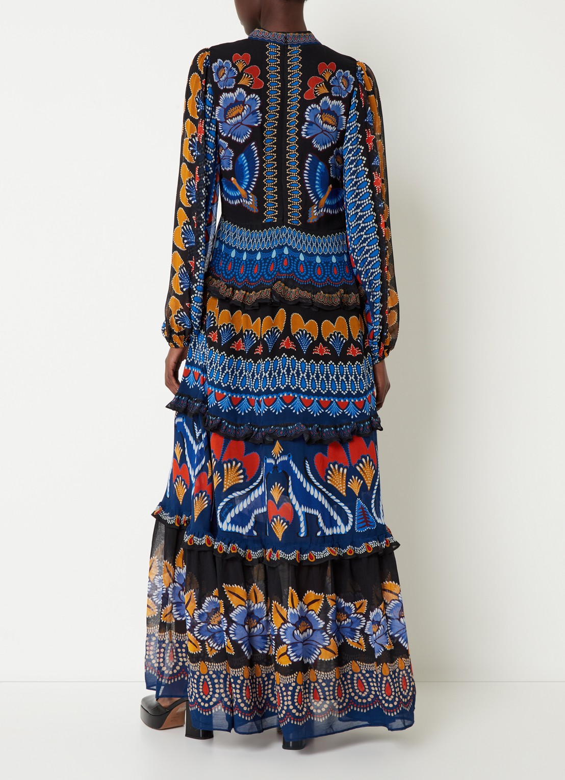 Elevate your wardrobe with the Anika Maxi Dress by Farm Rio, featuring vibrant prints and delicate ruffles that add a touch of feminine charm. The long sleeves provide coverage for cooler days while maintaining a flowy, elegant silhouette perfect for any occasion. This dress combines comfort and style effortlessly, making it an ideal choice for day-to-night wear. Transform your look with a splash of color and graceful movement in the Anika Maxi Dress.