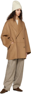 Elevate your style with our Double-Breasted Shawl-Collar Coat by TOTEME. Made from luxurious felted wool, this jacket features raised seams for a polished look. The shawl lapel and double-breasted button closure add a touch of sophistication while the welt pockets offer practicality. Stay fashionable and warm this season.