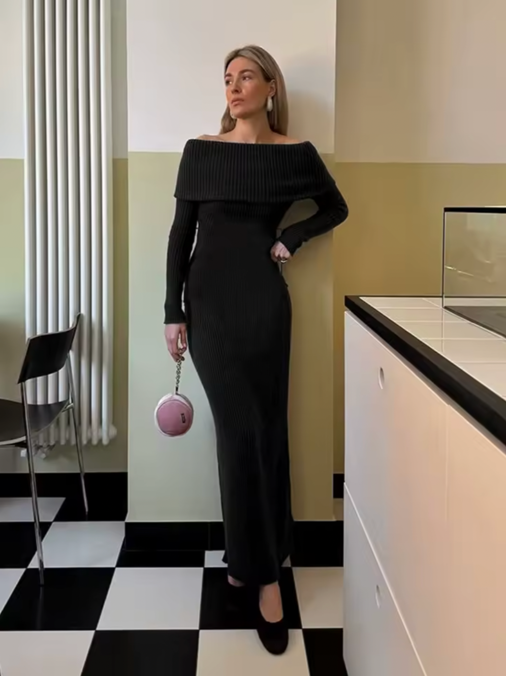 This knitted midi dress offers a perfect balance of comfort and sophistication. Crafted from stretchy knit fabric, it ensures ease of movement with a relaxed fit. The folded off-shoulder neckline adds an elegant flair, complemented by long sleeves featuring subtle slit details for a refined, contemporary look. Ideal for sophisticated casual occasions, this dress delivers effortless style without compromising on wearability.