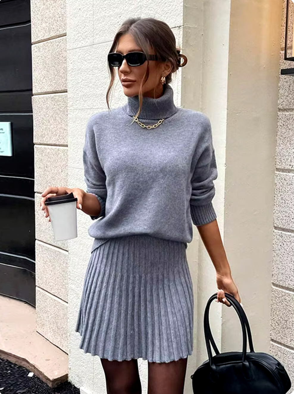 Indulge in luxury with the Margot Knit Blend Set. Elevate your style with this high collar, solid color pullover set for women. The long sleeve combines effortlessly with the elegant casual skirts for a refined and sophisticated look.