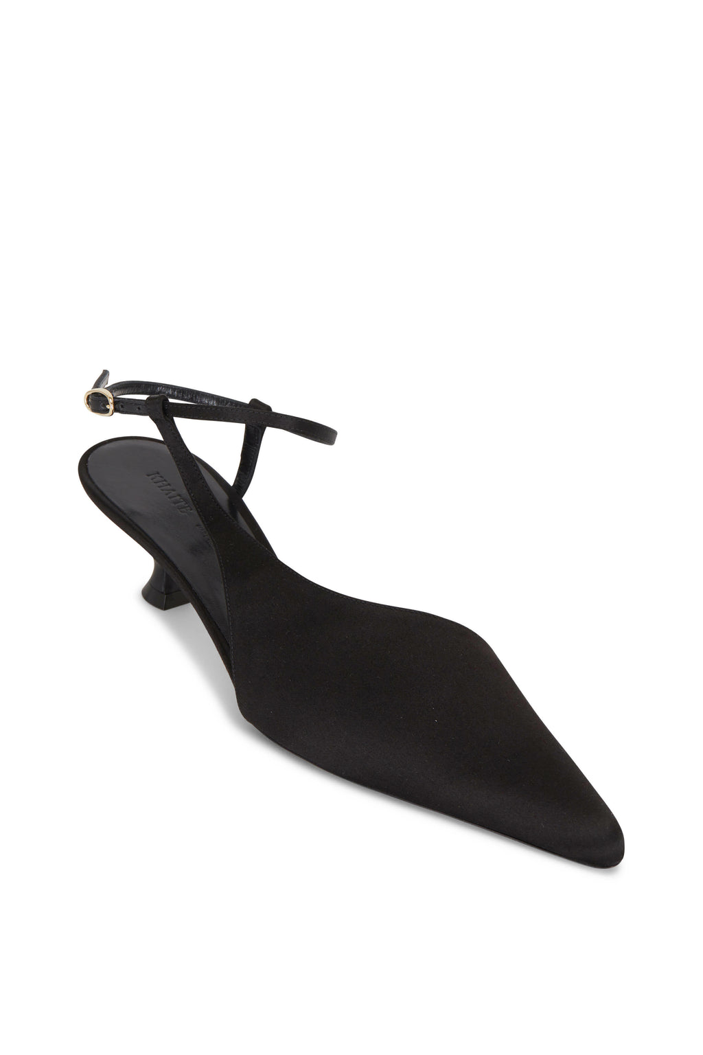 Indulge in luxury with the Seville Pumps by KHAITE. The curvy cutaway design not only accentuates the arch of the foot but also creates the illusion of longer legs. Handcrafted in Italy with impeccable attention to detail, from the tonal topstitching to the elegant satin kitten heel. Elevate any outfit with these sophisticated and exclusive pumps.