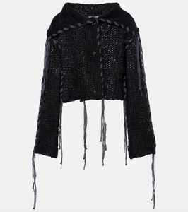 Experience refinement and warmth with the Black Lacing Knit Cardigan by Acne Studios. This exquisite piece features a hand-knitted blend of wool and mohair, complemented by intricate lace-up detailing on the body and sleeves. The elongated collar adds a touch of sophistication, while the waist length provides a flattering fit. Perfect for those seeking luxury and style in their wardrobe.