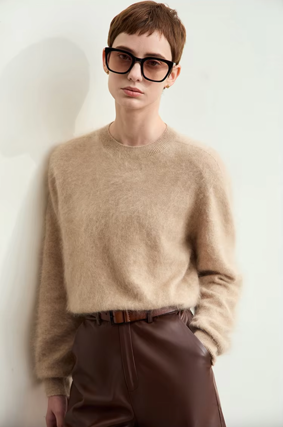 Introducing the Marni Mohair-blend Sweater, a luxurious blend of cashmere and wool. This minimalist sweater features a loose knit and soft, warm feel. Perfect for a luxurious fall look. Upgrade your wardrobe with this exclusive piece.