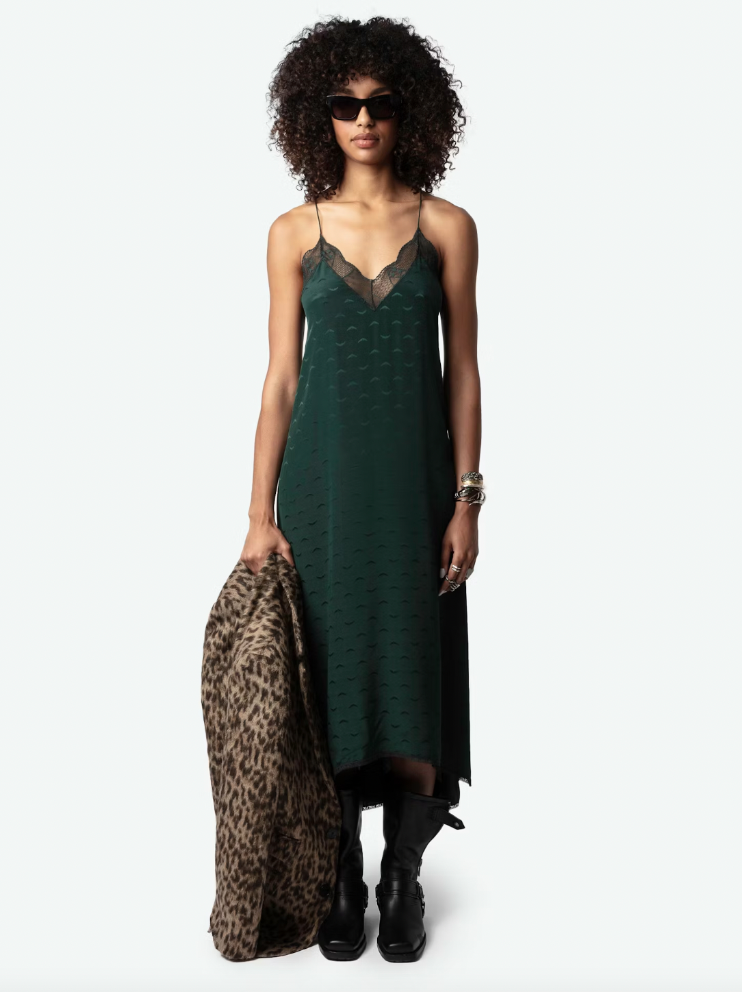 Experience ultimate luxury in the Risty Wings Silk Jacquard Dress by Zadig & Voltaire. Made from the finest Peaks dark green silk, this lingerie-style maxi dress features a delicate jacquard wings design and lace strips. The v-neckline, thin non-adjustable straps, and asymmetrical bottom add an alluring touch.