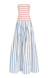 This strapless striped cotton gown by Rosie Assoulin features a sophisticated drop-waist silhouette that flatters the figure while offering comfort. Crafted from breathable cotton, its clean lines and bold stripes create a modern yet timeless look, ideal for elegant occasions where effortless style is paramount.