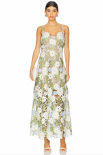 Load image into Gallery viewer, Elevate your style with the Flora Dress. This elegant gown is designed to turn heads at any occasion. Crafted with a flattering fit, the flared hemline adds a touch of drama as you make your entrance. Stand out in confidence with this fitted event-wear maxi dress.
