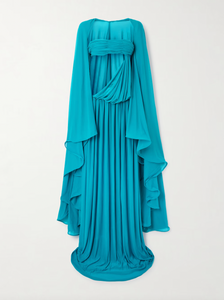 Experience the elegance of Christopher Esber’s Gyre dress, a stunning blend of volume and fluidity. Crafted from soft jersey, this maxi dress features a graceful cape-effect overlay and a bandeau bodice that cascades to a floor-length hem, creating effortless movement. Its vibrant turquoise hue draws attention, while the design’s delicate draping highlights your silhouette. Perfectly paired with silver jewelry, this statement piece embodies refined sophistication for any special occasion.