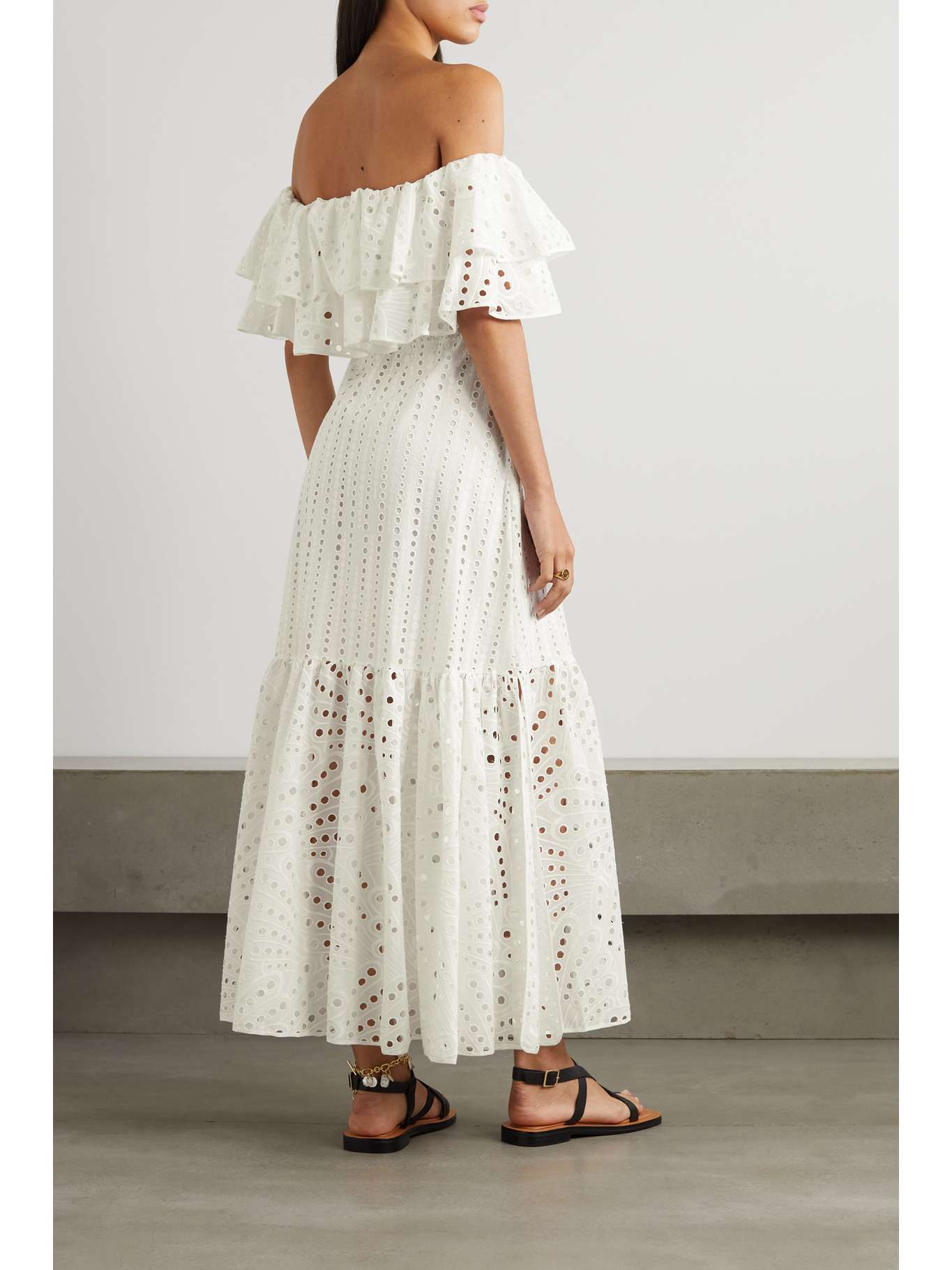 Get ready to show off your fun and flirty side with the Isabella Maxi Dress from Charo Ruiz! Made from a delicate broderie anglaise cotton-blend, this off-the-shoulder dress features tiered layers for added movement and style. Perfect for any occasion, this midi dress will have you feeling confident and fabulous.