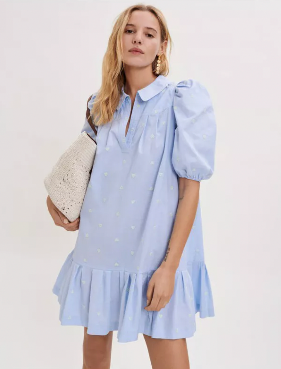 Introducing the beautifully crafted Embroidered Poplin Dress from Maje, made from high-quality crisp cotton poplin for a comfortable fit. Adorned with puffed sleeves, a Peter Pan collar, and a frilled hem, this dress is both stylish and versatile. Perfect for any occasion, add this dress to your wardrobe today!