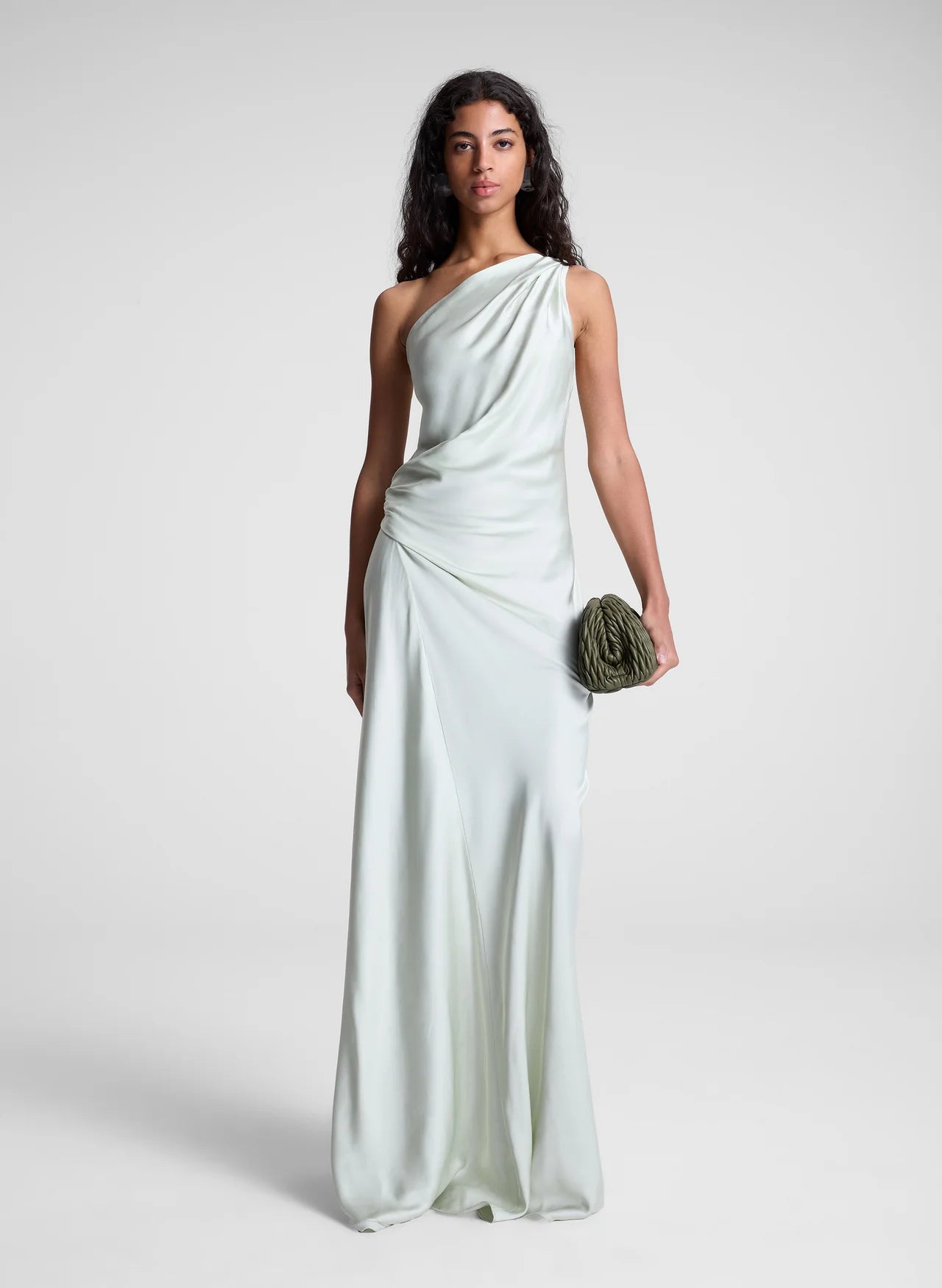 The Aster Satin One Shoulder Gown by A.L.C in radiant chartreuse offers a stunning blend of elegance and modern design. Crafted from smooth satin, it features a graceful one-shoulder cut that flows beautifully over the body. Soft pleats at the shoulder and waist sculpt the silhouette, while the asymmetrical design enhances movement and visual interest. Perfect for making a memorable statement, this gown effortlessly combines sophistication with bold charm.