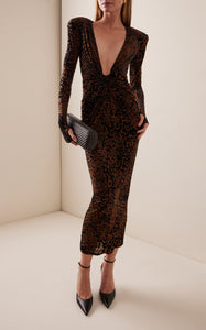 Indulge in the sultry allure of the Plunged Leopard Burnout Mesh Midi Dress by Alex Perry. Crafted from leopard-print burnout mesh, this bodycon silhouette features a deeply plunged neckline that will turn heads. Designed for the Fall/Winter '24 collection, this dress is both sexy and sophisticated. Concealed zip fastening along the back adds a touch of refinement. Made with stretch mesh in a designer color of tobacco, this dress is sure to make a statement at any event.