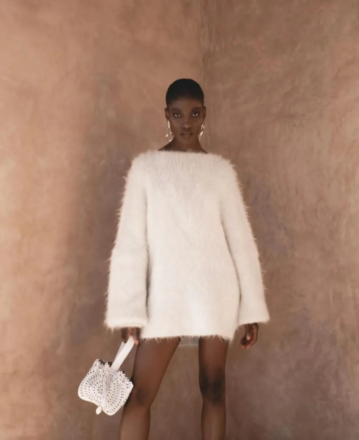Elevate your wardrobe with the Gemini Sweater, a refined solid knit pullover designed to turn heads. Its daring backless style adds a touch of allure, while the loose fit and round neckline ensure all-day comfort. Long sleeves provide cozy warmth, making it the perfect blend of sophistication and ease. Step out confidently and make a memorable statement with this unique, stylish sweater.