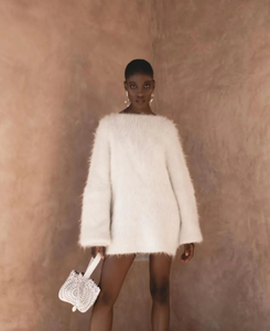 Elevate your wardrobe with the Gemini Sweater, a refined solid knit pullover designed to turn heads. Its daring backless style adds a touch of allure, while the loose fit and round neckline ensure all-day comfort. Long sleeves provide cozy warmth, making it the perfect blend of sophistication and ease. Step out confidently and make a memorable statement with this unique, stylish sweater.