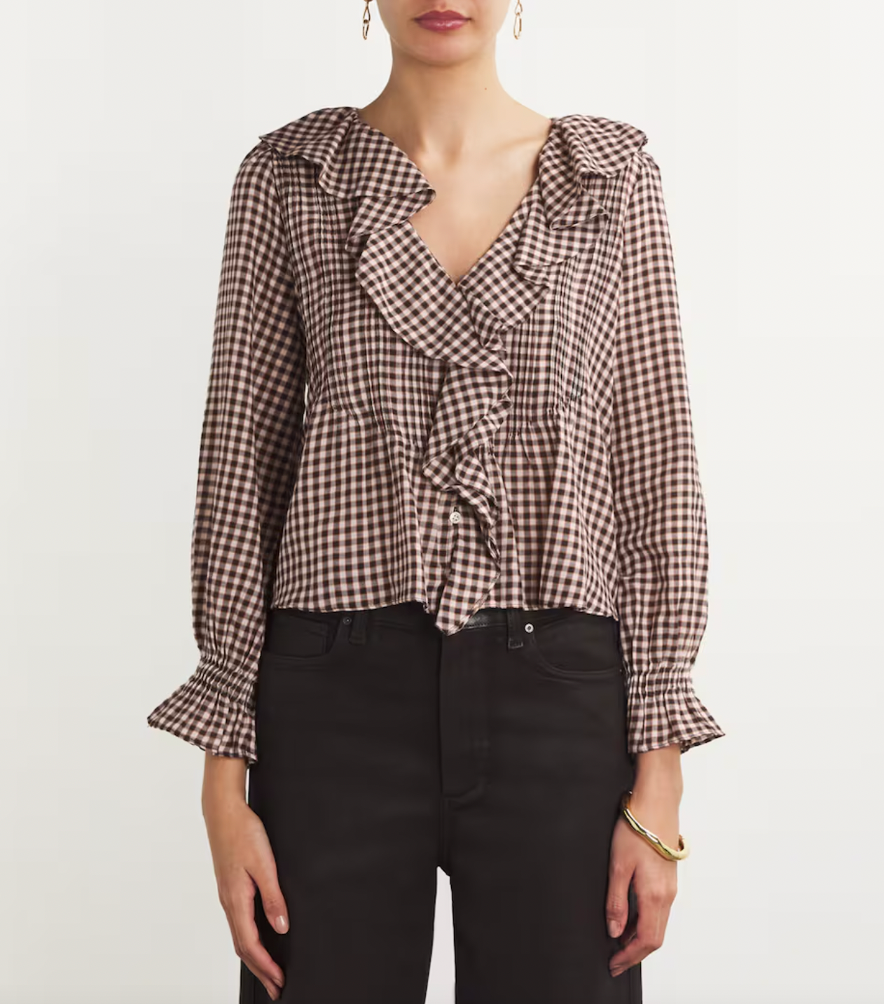 Embrace bohemian style with the Hardy blouse from Dôen. Made with organic cotton voile, this ruffled top features a playful plaid print for a touch of nostalgia. Perfect for a casual, retro-inspired look.