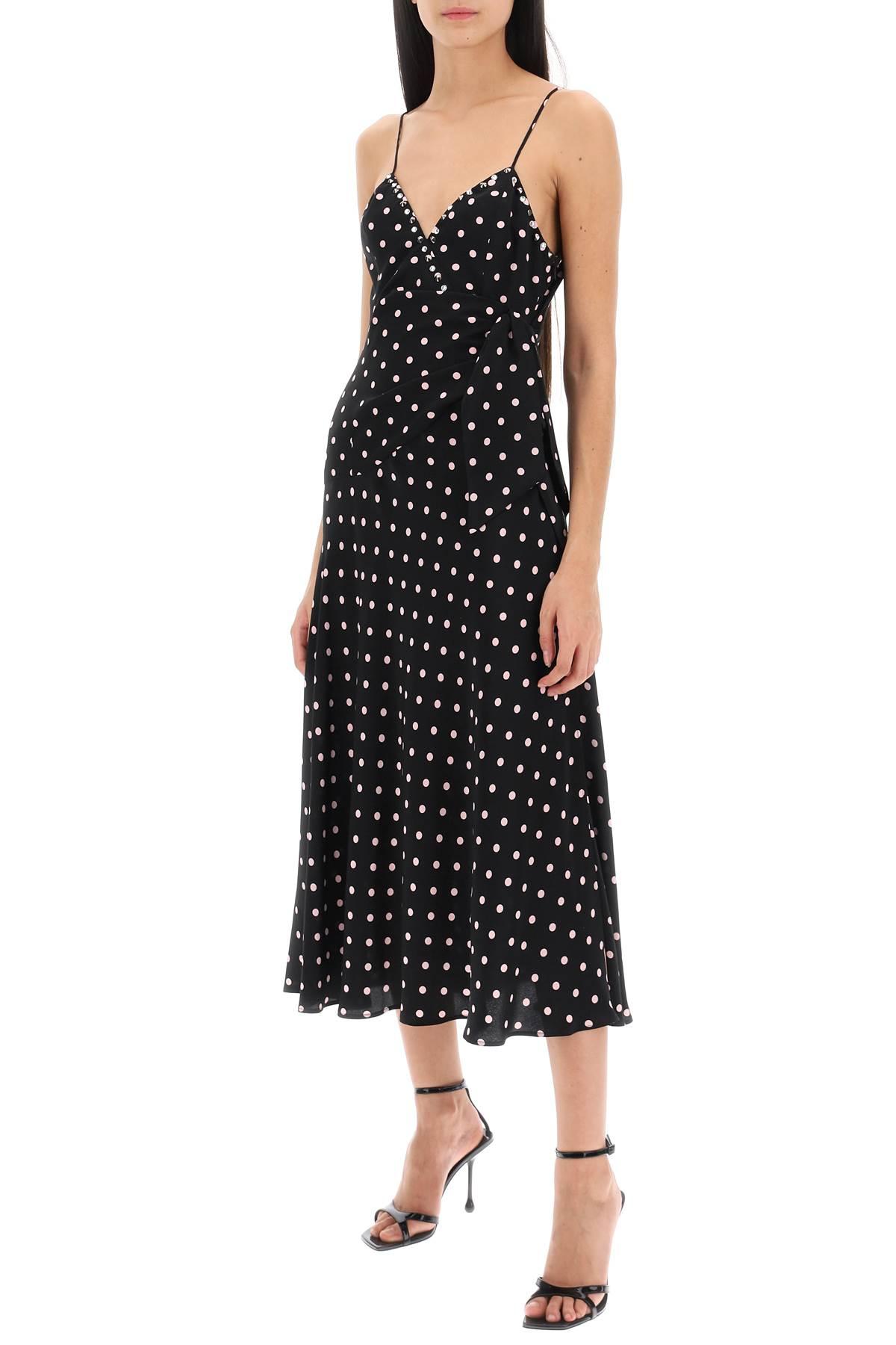 This high-quality designer slip dress, adorned with a playful polka dot print and finished with a delicate bow, is a top-of-the-line addition to any wardrobe. Handmade by industry experts, this Alessandra Rich dress offers a slinky, sophisticated silhouette perfect for any occasion.