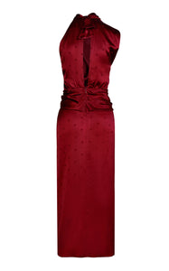 Elevate your style with the Warrior Tradition Draped Silk Maxi Dress by Johanna Ortiz. The slim fit, draped neckline, and one-shoulder design add a touch of sophistication, while the knotted waist and metallic knot pen create a chic silhouette. The dotted texture and midi hem add a touch of elegance to this lined dress.