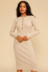 Experience effortless chic this autumn and winter with our Ines Midi Dress. Made from high-quality rib knit fabric, this vintage cutout dress features a figure-hugging silhouette, cascading cut-outs with bows, and a crew neckline. Perfect for work from home or dressing up on off-duty days. Complete the look with mid-calf heeled boots and a snakeskin baguette bag.