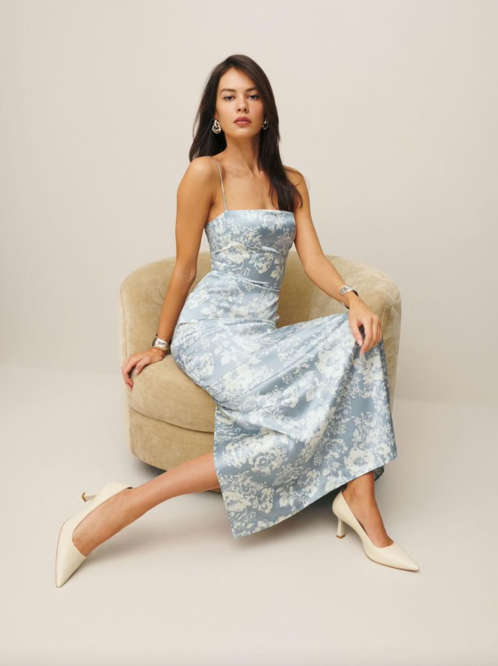 Experience luxury in our Frankie Silk Porcelain dress. Made of 100% silk with a lightweight charmeuse fabric, it features a square neckline, back slit, back smocking, non-adjustable straps, and a high slit. Dry clean only. Elevate your style with effortless sophistication.