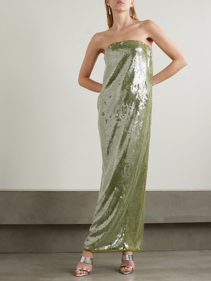 Elevate your evening with the Casey Paillette-embellished Maxi Dress by STAUD, a stunning strapless design that commands attention. Crafted from luxurious stretch-tulle, this gown features intricate paillette embellishments that catch the light beautifully, creating an enchanting shimmer with every movement. The rich green hue offers timeless sophistication while the strapless silhouette provides an elegant, modern edge. 