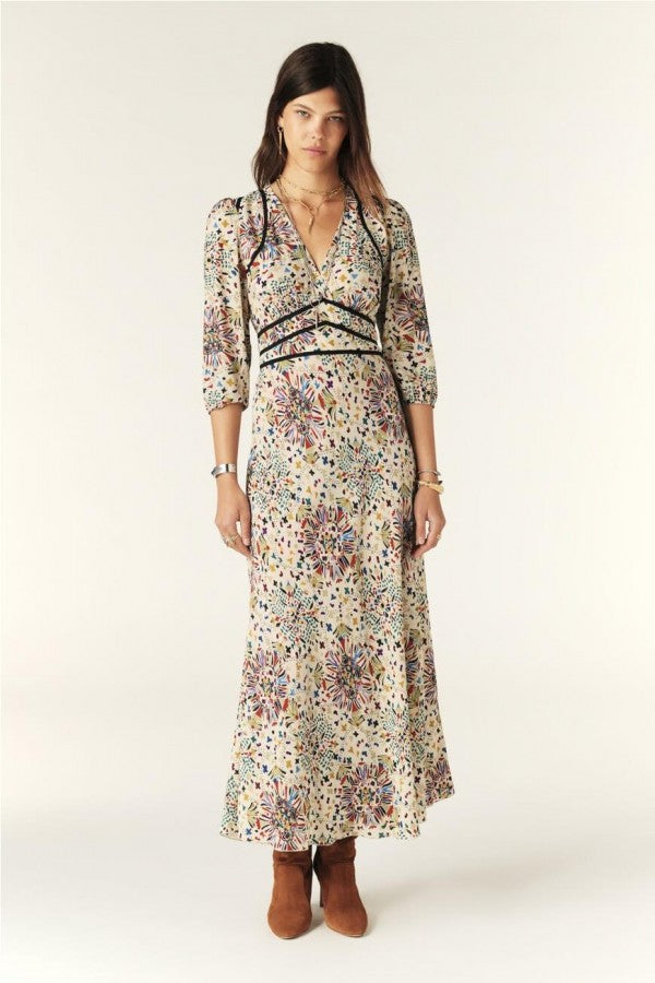 Introducing the Fazia Maxi Dress from Ba&sh , a versatile piece that combines style and comfort. With its flowy fabric, elastic sleeves, and cinched waist, this dress flatters all body types. The deep V-neck and graphic print add a touch of modernity, making it a must-have for any occasion.