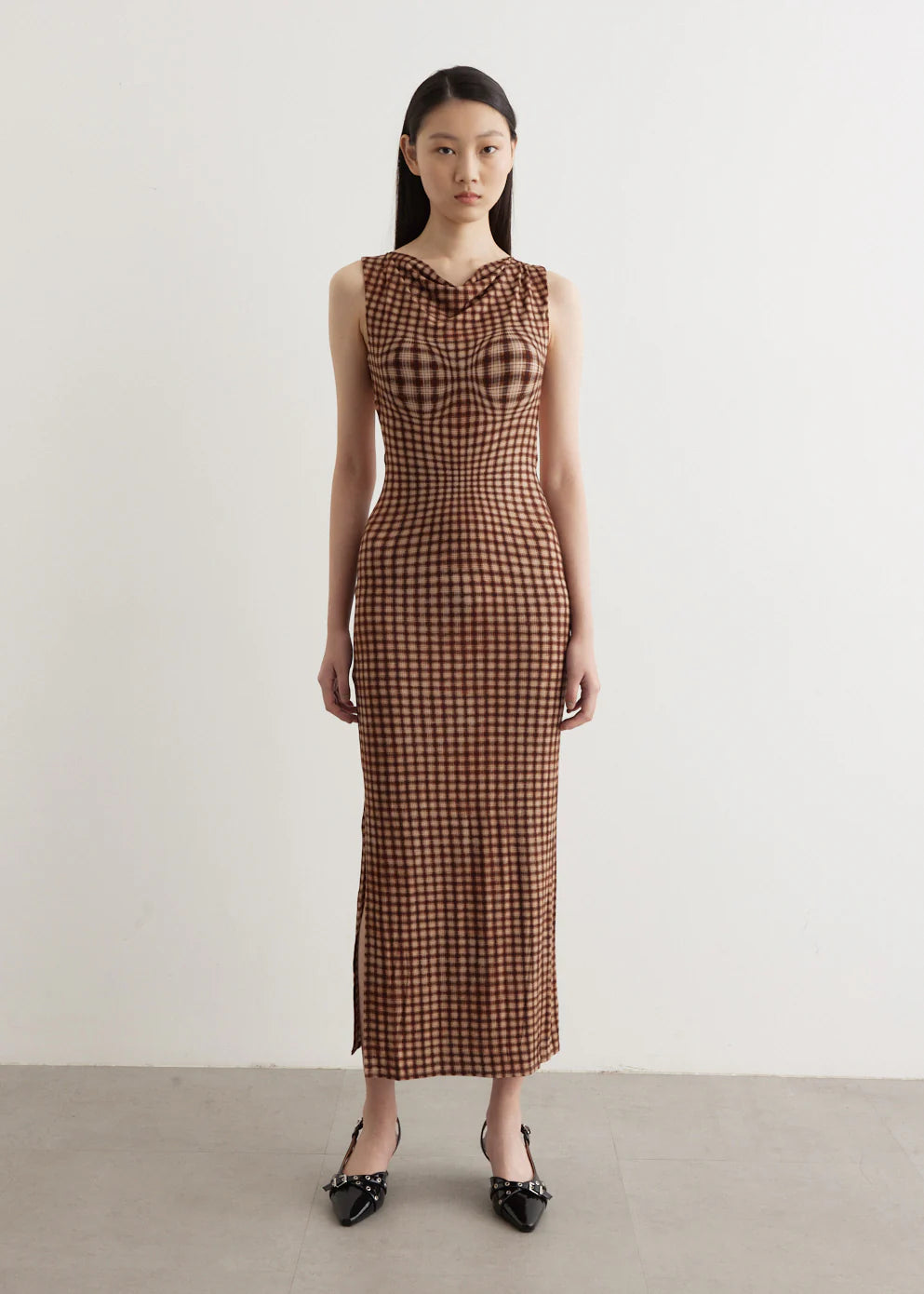 Channel your inner '90s supermodel in the Selena Dress by MIAOU. Made from a soft Tencel blend, this form-fitting maxi dress features a unique plaid pattern for a touch of sophistication. With a round neckline, sleeveless design, and open back, it's the perfect combination of French-girl style and SoCal cool.