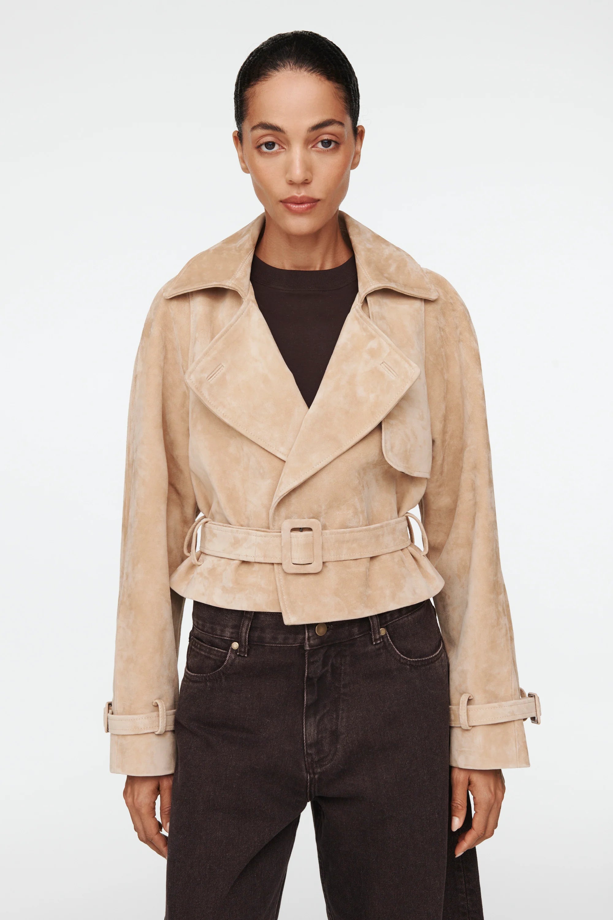The Millie Suede Jacket by Ducie reimagines the classic trench with modern flair. This cropped silhouette features an oversized collar that commands attention, while adjustable belts at the hem and sleeves offer customizable styling and a polished finish. Effortlessly versatile, it's the ideal layer for elevating your spring and summer wardrobe with contemporary edge and timeless sophistication.