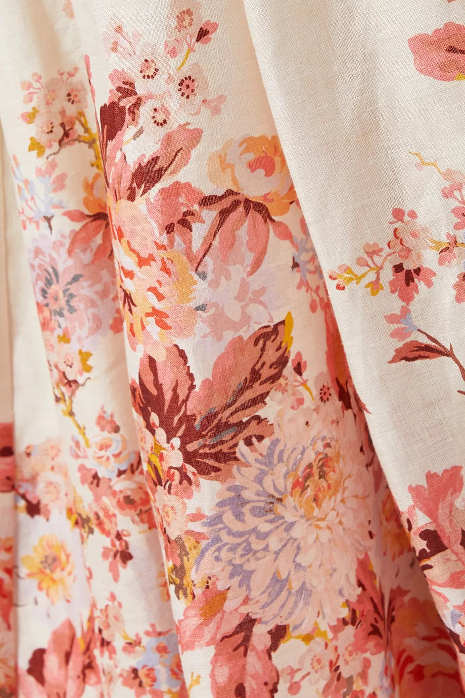 Indulge in the luxury of the Devi Scallop Midi Dress in Linen by Zimmermann. With its vibrant floral print, airy linen fabric, and intricate embroidered scalloped edging, this dress exudes effortless elegance. The flared silhouette, waist cut-outs, and lace-up back provide a playful yet sophisticated touch. Perfect for a summer garden party.