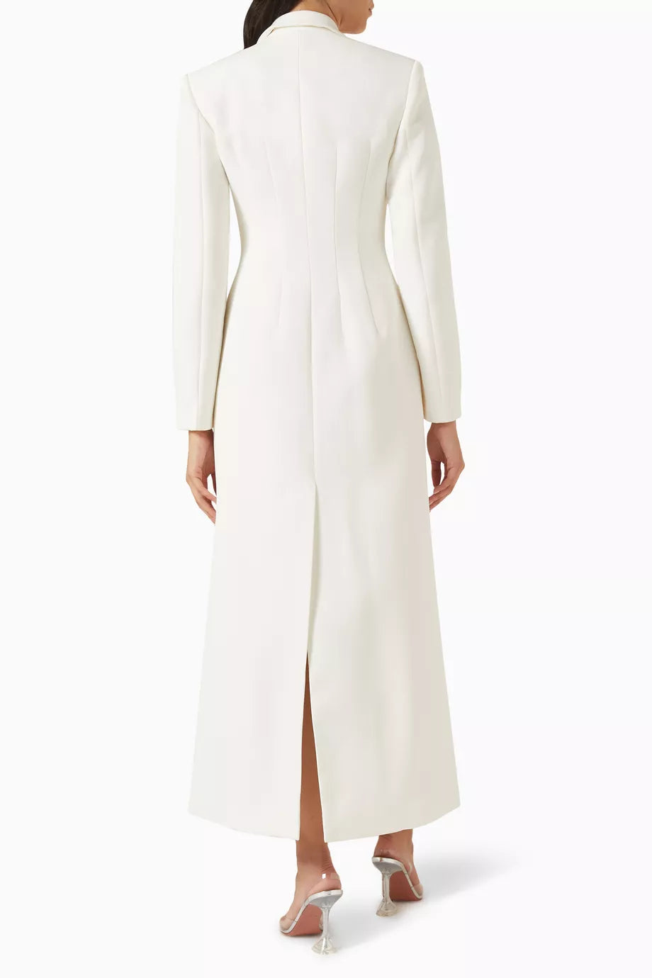 The Talgo Bar Suit Blazer Coat by Chats C.Dam is your essential layering piece for effortless style. This tailored twill-suiting blazer features a sharp notched lapel, streamlined front closure, and distinctive buckled strap detail that elevates any outfit. Whether you're rushing through your morning or transitioning from office to evening, pair it with pumps for polished sophistication or heeled boots as the season turns cooler. 