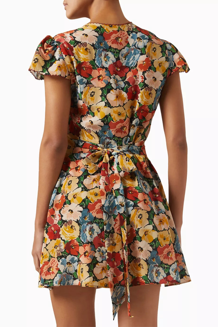 DÔEN’s Dianne Floral Mini Dress in Silk Blend offers effortless elegance for brunches and garden parties. Made from a luxurious silk blend, it drapes gracefully to flatter your silhouette. The adjustable tie-up waist allows for a customized fit, enhancing your figure with subtle definition. Pair it with flats for daytime ease or elevate your look with kitten heels for special events. This versatile dress combines refined comfort with timeless style.