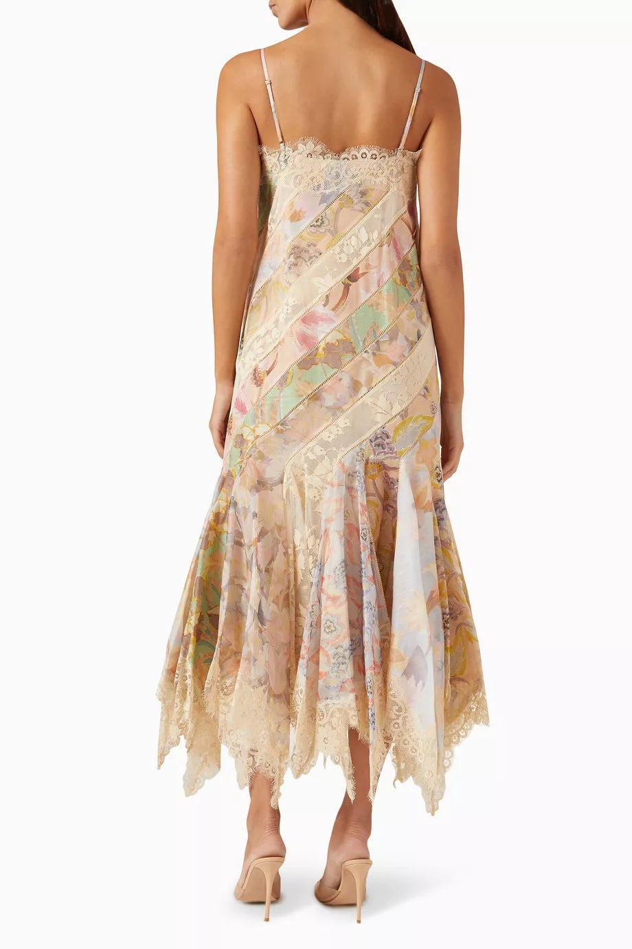 Impress at any elegant event with Zimmermann's Eden Spliced Slip Dress. Made from a luxurious cotton blend, this dress boasts adjustable shoulder straps and a flared hanky hem perfect for twirling on the dance floor. Seen on the FW 2024 runway, it will surely turn heads when paired with heeled sandals.