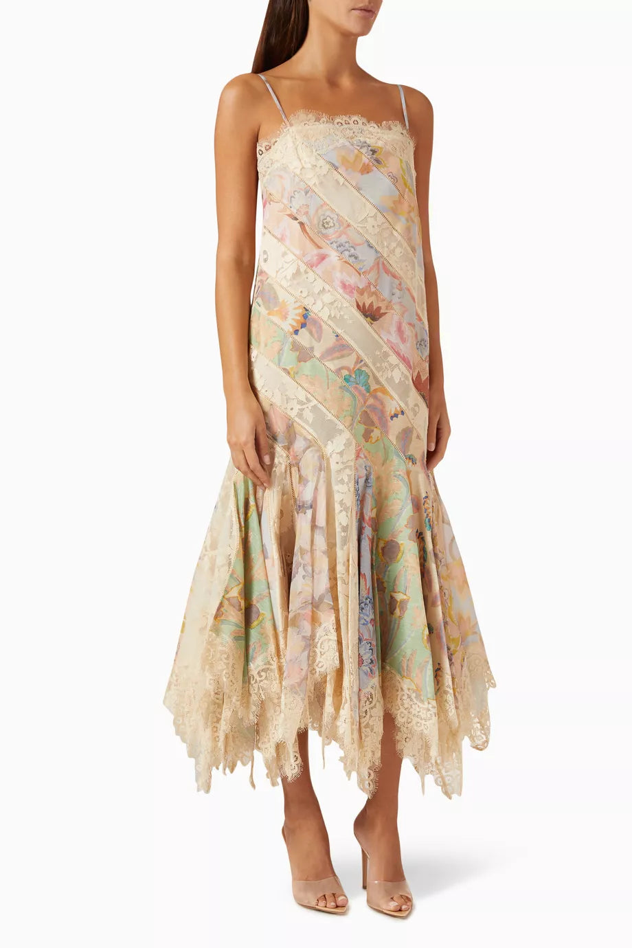 Impress at any elegant event with Zimmermann's Eden Spliced Slip Dress. Made from a luxurious cotton blend, this dress boasts adjustable shoulder straps and a flared hanky hem perfect for twirling on the dance floor. Seen on the FW 2024 runway, it will surely turn heads when paired with heeled sandals.