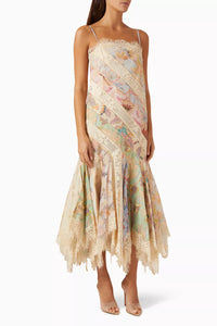 Impress at any elegant event with Zimmermann's Eden Spliced Slip Dress. Made from a luxurious cotton blend, this dress boasts adjustable shoulder straps and a flared hanky hem perfect for twirling on the dance floor. Seen on the FW 2024 runway, it will surely turn heads when paired with heeled sandals.