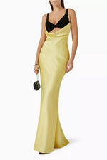 Load image into Gallery viewer, Upgrade your evening wear with Rasario&#39;s luxurious draped maxi dress. The silk velvet bodice showcases your décolletage and collarbone, while the crepe satin skirt accentuates your curves. Make an elegant statement with this refined piece, paired with heels and a chic clutch.
