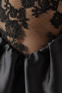 The Lace Maxi Dress in Taffeta by Self-Portrait embodies classic sophistication, blending structured taffeta with intricate lace accents. This elegant design offers a refined silhouette ideal for formal events. Enhance your look with statement earrings and sleek heels to complete a polished evening outfit.