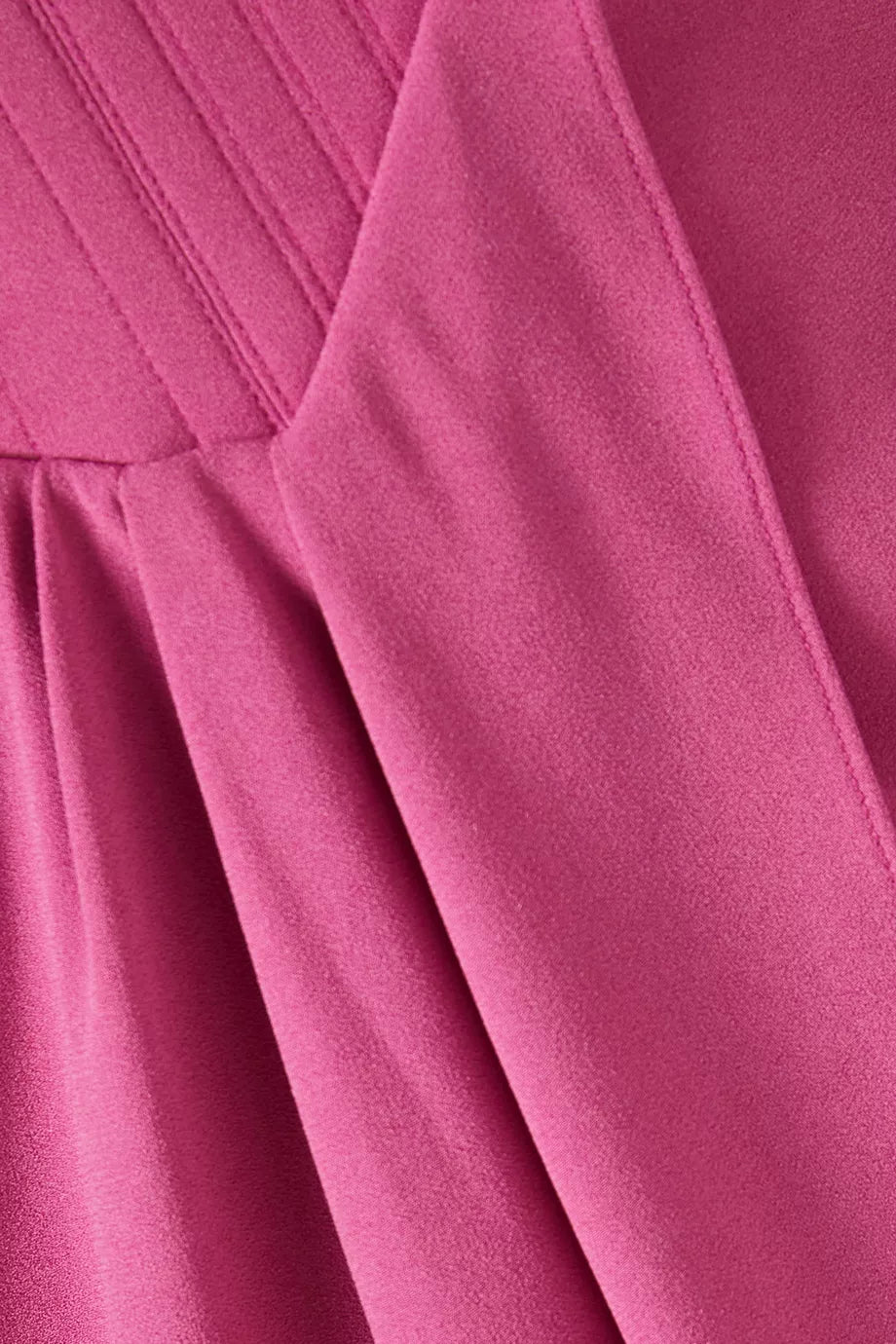 The Corset Asymmetrical Drape Gown in Crepe by Alex Perry is your answer to effortless elegance. Sculpted from luxurious crepe, the structured corset bodice flatters your silhouette while the asymmetrical draping creates an understated, sophisticated statement. Whether you're attending a wedding reception, gala, or black-tie event, this gown delivers timeless glamour without demanding excess. 