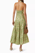 Load image into Gallery viewer, Introducing the Willow Printed Dress in Linen by Palm Noosa. Made from luxurious linen, this halter-neck dress boasts a flowy skirt and elastic back for a comfortable fit. The fitted bodice and waist highlight your curves. Perfect for a summery, effortless look with sandals and a straw hat.
