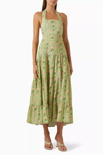 Load image into Gallery viewer, Introducing the Willow Printed Dress in Linen by Palm Noosa. Made from luxurious linen, this halter-neck dress boasts a flowy skirt and elastic back for a comfortable fit. The fitted bodice and waist highlight your curves. Perfect for a summery, effortless look with sandals and a straw hat.
