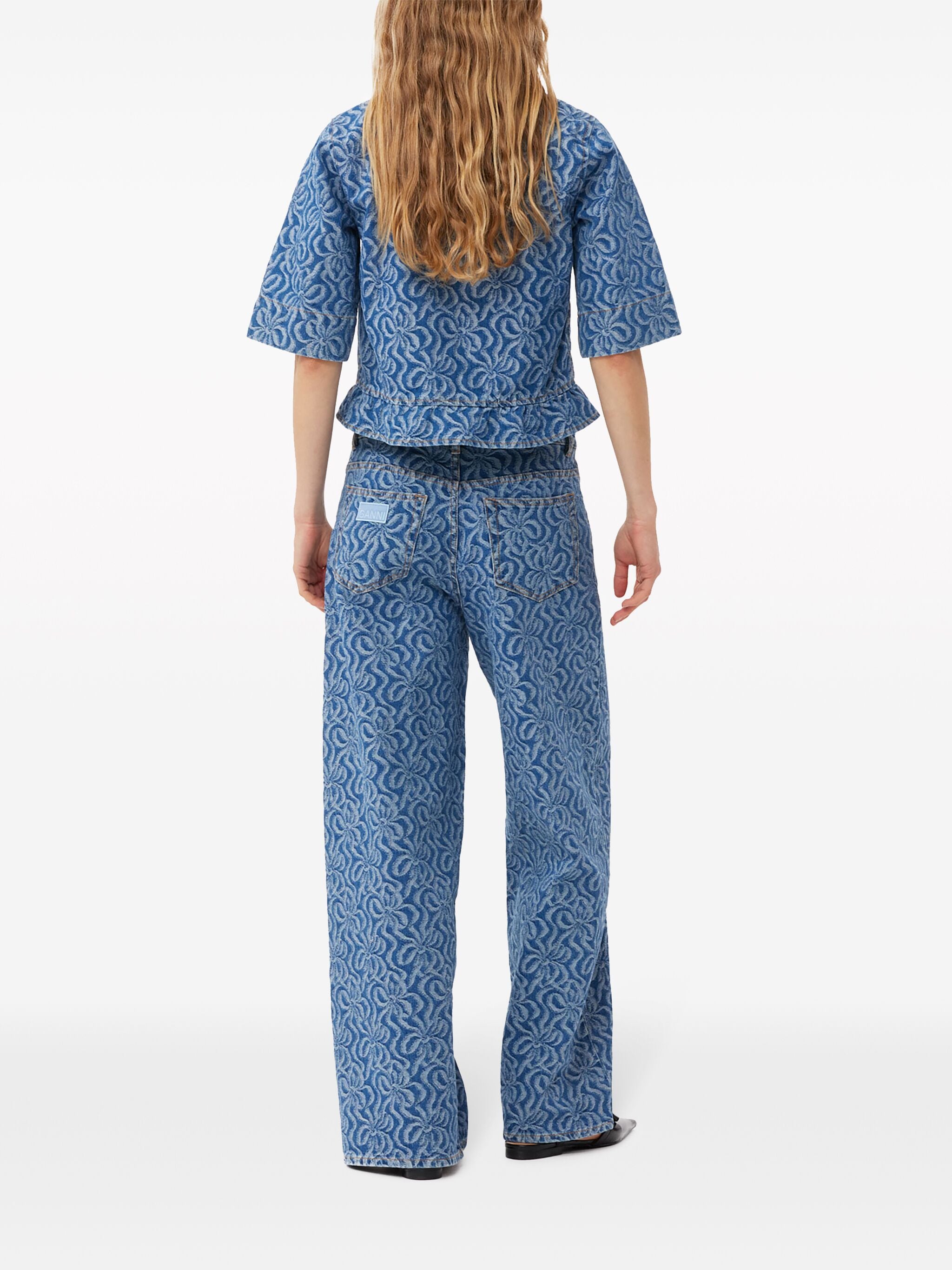 Elevate your wardrobe with Ganni's jacquard organic-cotton denim blouse. Made from premium, sustainable organic cotton, this blouse features a unique jacquard print that adds texture and style to any outfit. With a relaxed fit and casual vibe, this blouse is perfect for everyday wear.