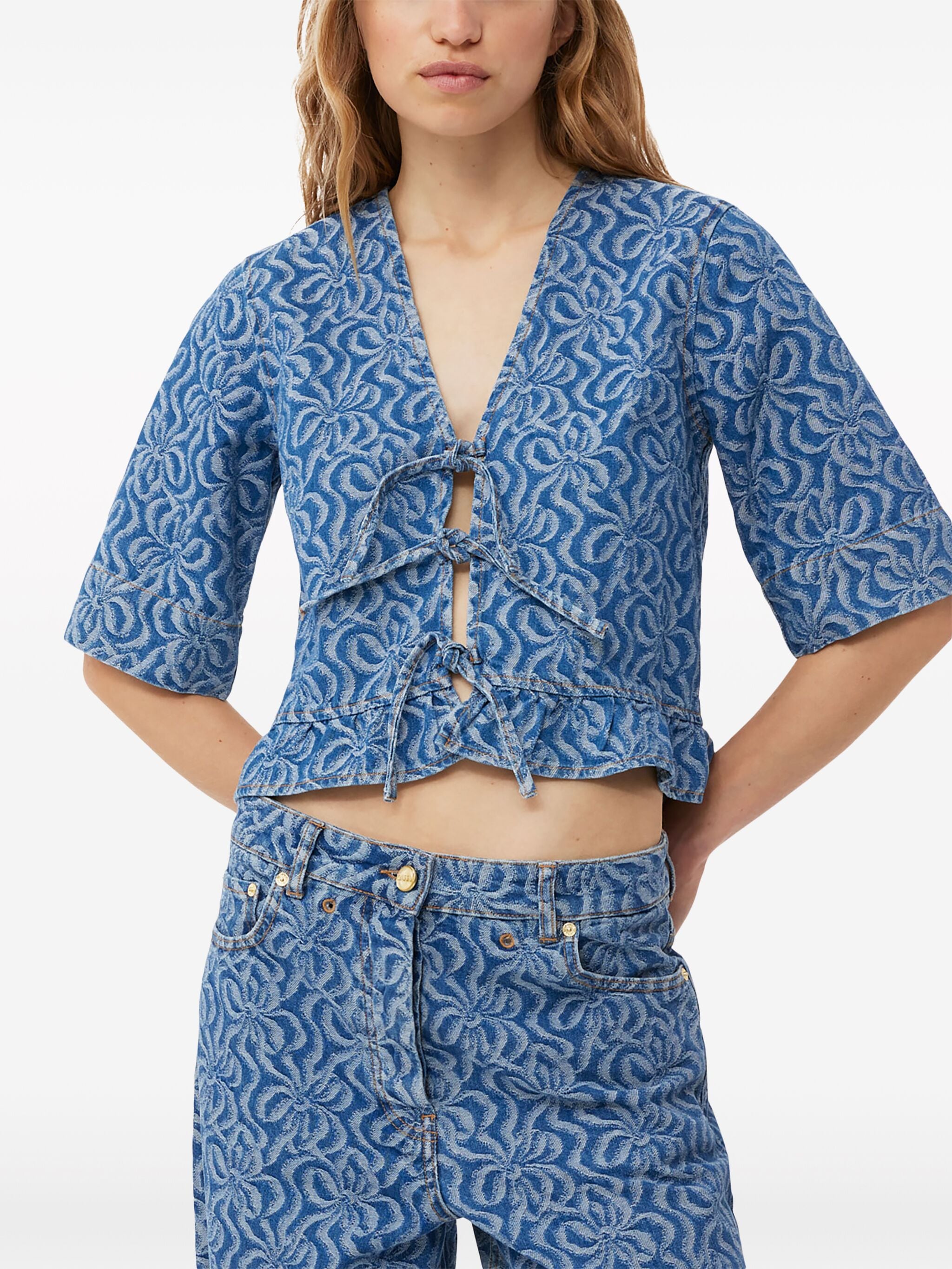 Elevate your wardrobe with Ganni's jacquard organic-cotton denim blouse. Made from premium, sustainable organic cotton, this blouse features a unique jacquard print that adds texture and style to any outfit. With a relaxed fit and casual vibe, this blouse is perfect for everyday wear.