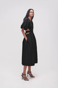 It's hard to resist the charm of Aje's 'Mimosa' dress silhouette. Made from a lightweight linen blend with a cotton lining for added opacity, the dress includes puffed sleeves, a fitted bodice, and waist cutouts. Easily pair it with mules or strappy sandals for a stylish look.