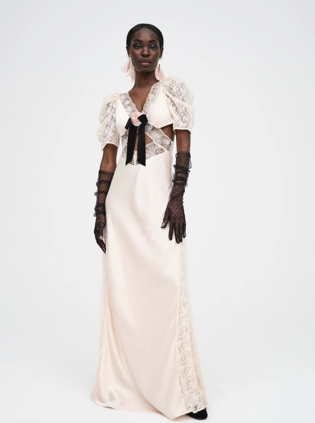 Introducing the Corinne Maxi Dress, a stunning and elegant piece from our French vintage collection. Made from luxurious silk, this maxi dress features delicate embroidery and a vintage-inspired bow. Perfect for special occasions, it's a true work of art in the world of fashion.