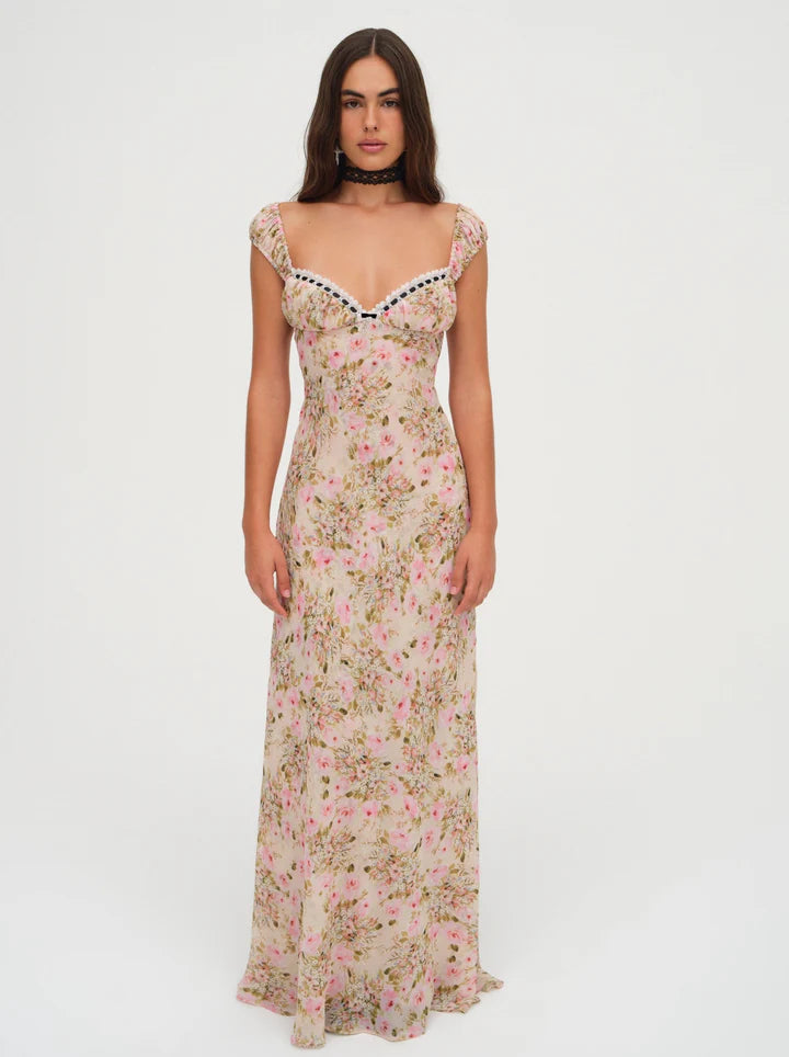 Love is in bloom with this ultra-romantic Emmaline floral maxi dress—a chiffon light yellow dress decorated in a dream-like floral print. Featuring ruched cups with an alluring ribbon lace trim at the sweetheart neckline—it's the perfect wedding guest dress to celebrate love.